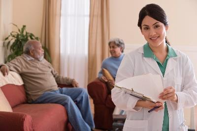 caregiver and elders smiling